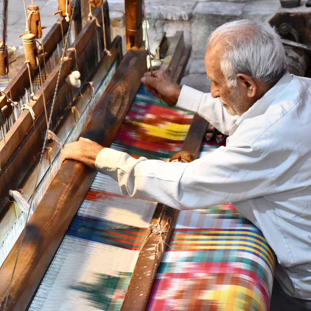 Artisan hands on a loom